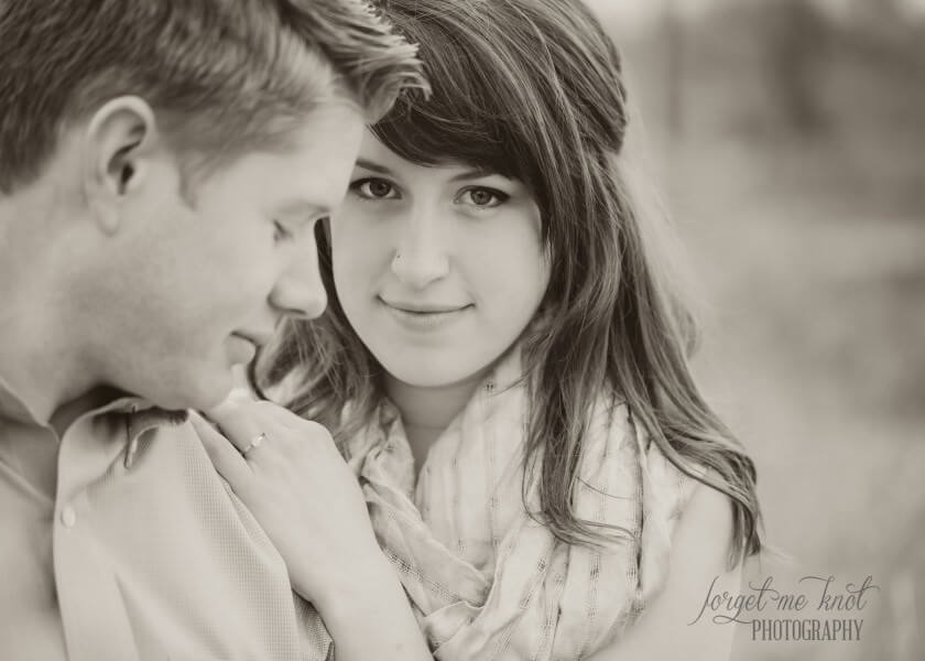 close up black and white photo of couple in a field at grange audubon