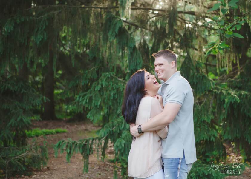 engaged couple with arms around each other at Inniswood Metro Gardens engagement