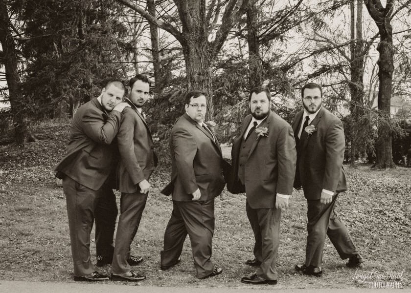 black and white photo of groom and groomsmen posing