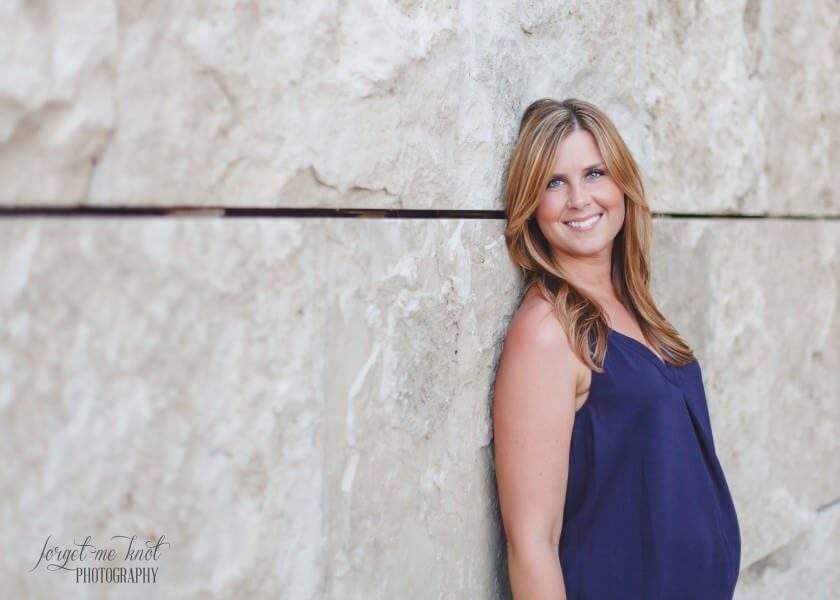 photo of bride to be leaning on wall