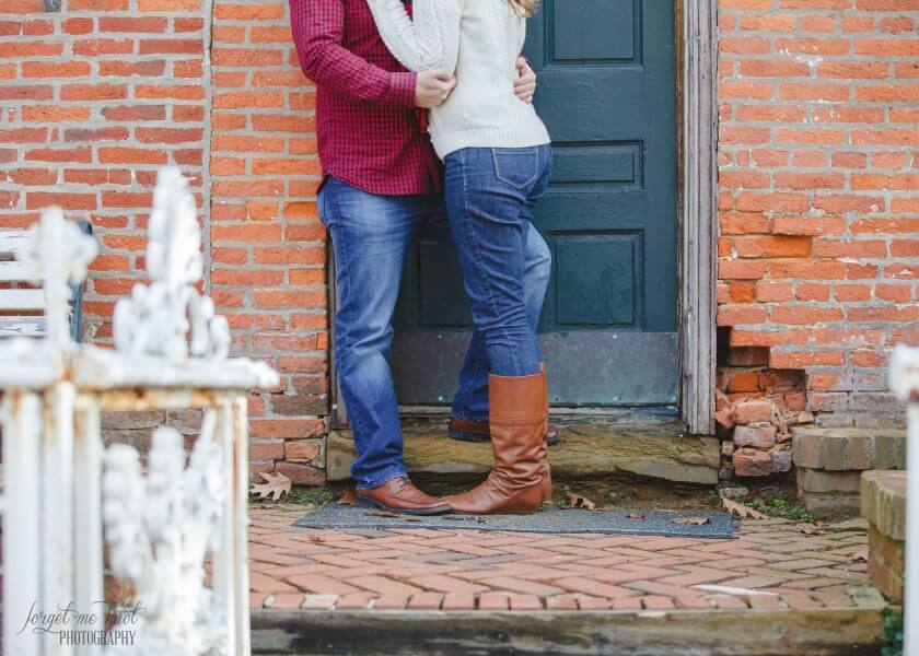 couples legs standing in a door way 