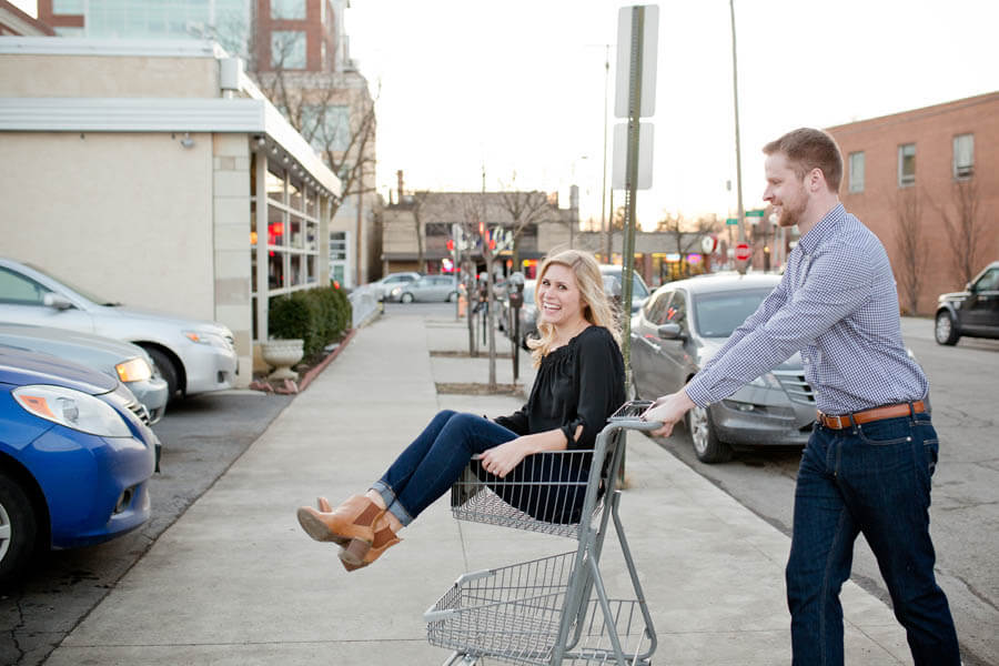 engagement photo of couple in grocery cart