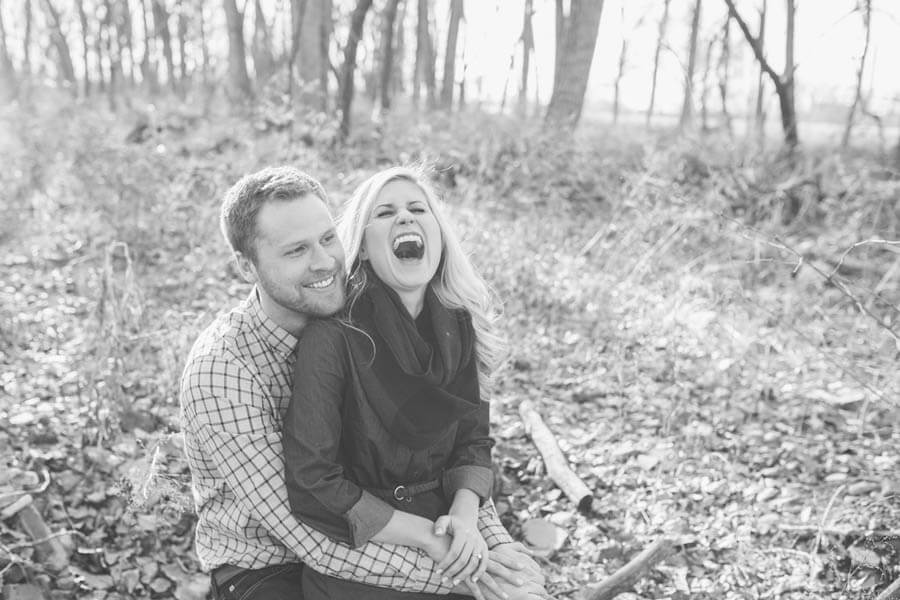 engagement photo of couple laughing