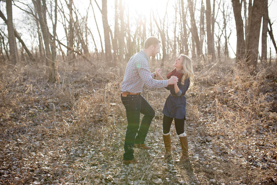 engagement photo os couple dancing in sunshine