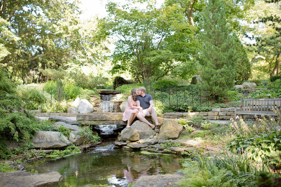 engaged couple sitting at Inniswood Metro Gardens