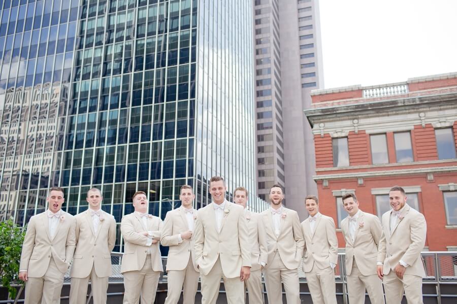 laughing groom and groomsmen at downtown columbus renaissance