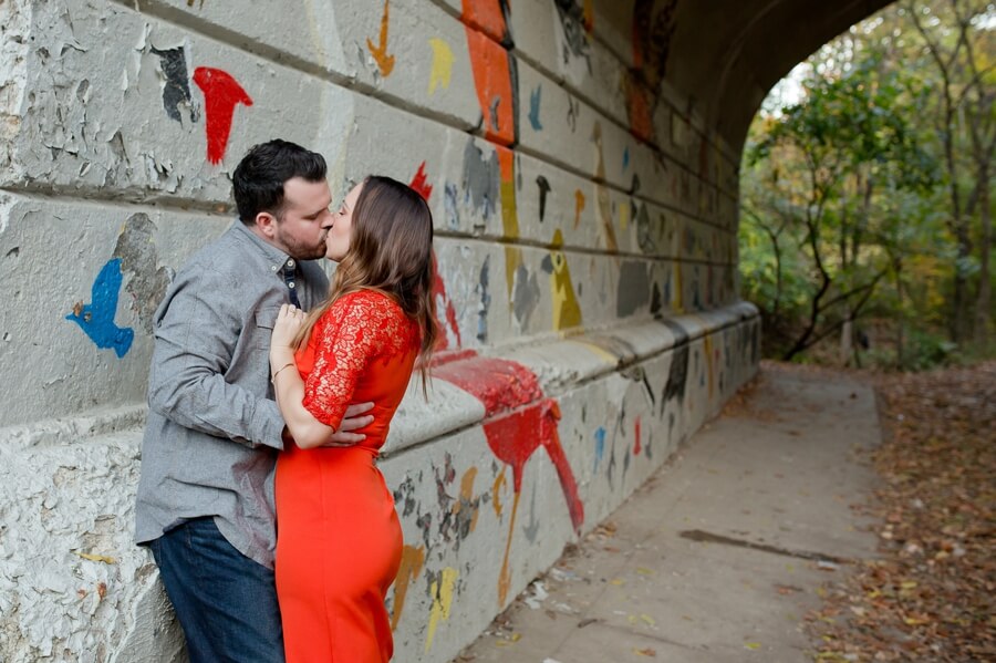 couple kissing under bridge at Stauf's Grandview Engagement