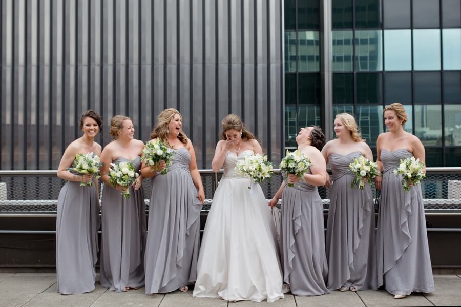 bride and bridesmaids laughing
