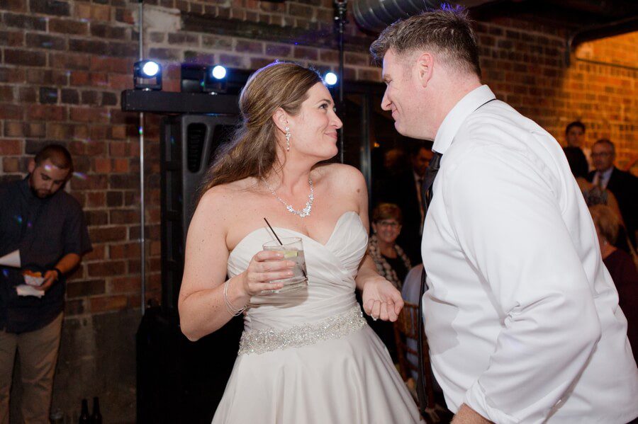 bride and groom dancing at reception at dock 580