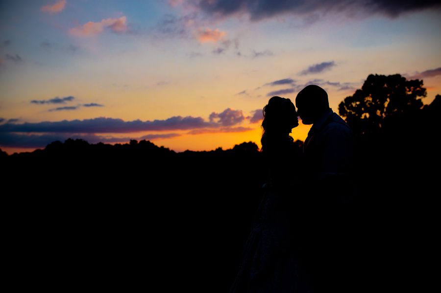 silhouette of bride and groom at grand vue park