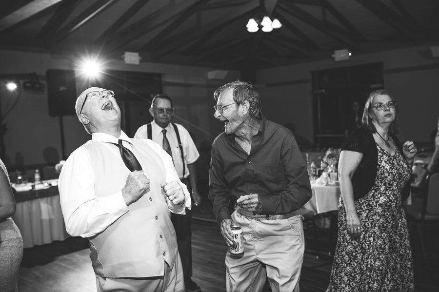 wedding guest laughing at reception