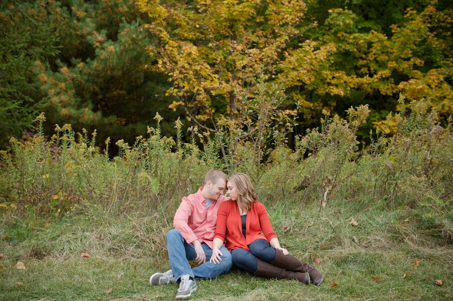 engaged couple laying in grass at Highbanks Metro Park Columbus, Ohio