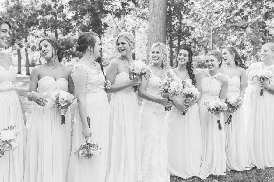 bride and bridesmaids laughing at the darby house