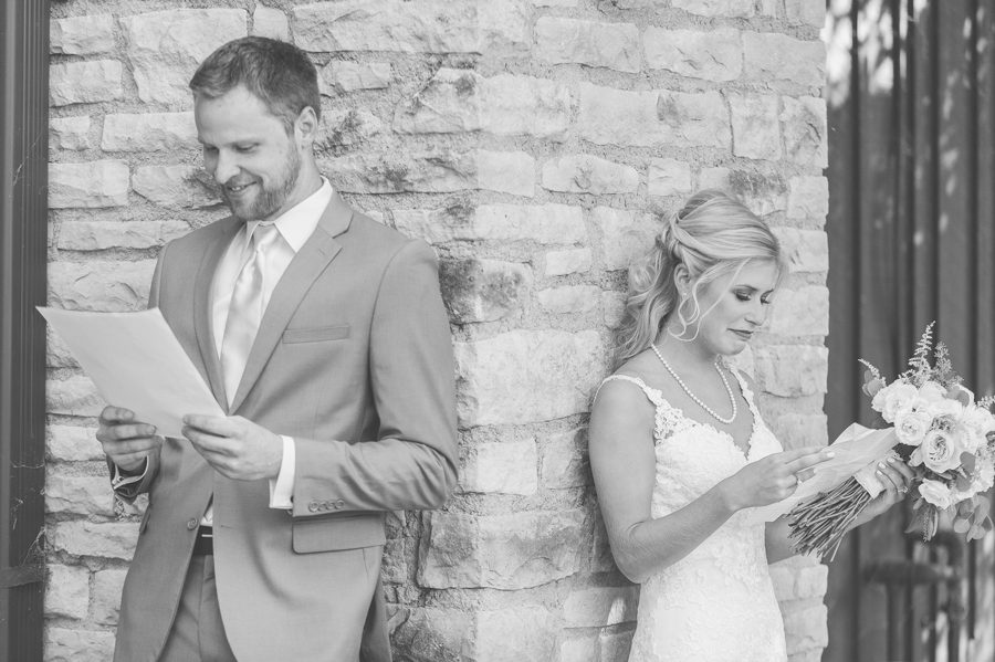 bride and groom reading love letters