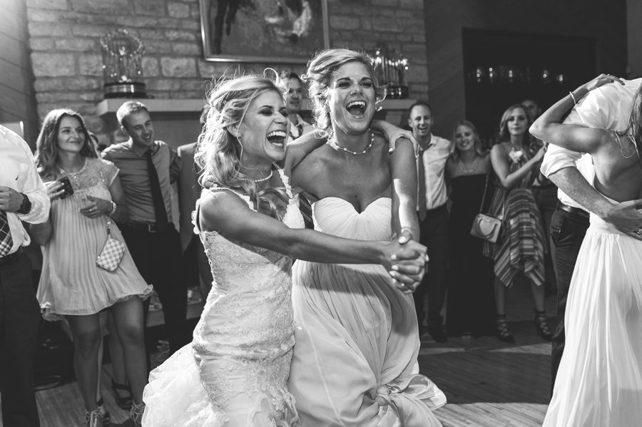 bride dancing with sister