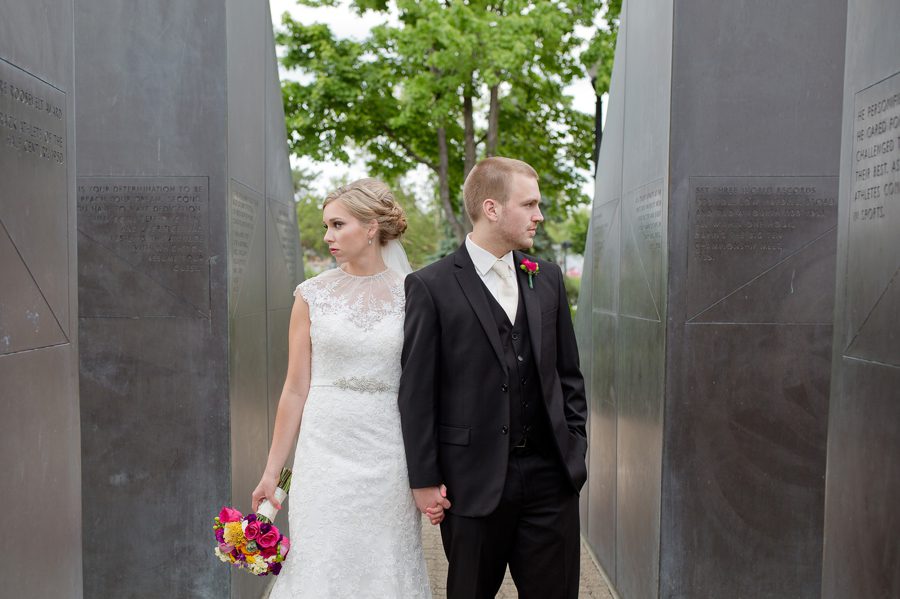 bride and groom looking opposite directions