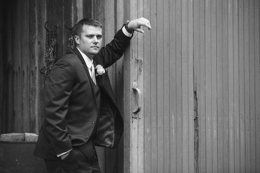 black and white photo of groom at a barn wedding in ohio