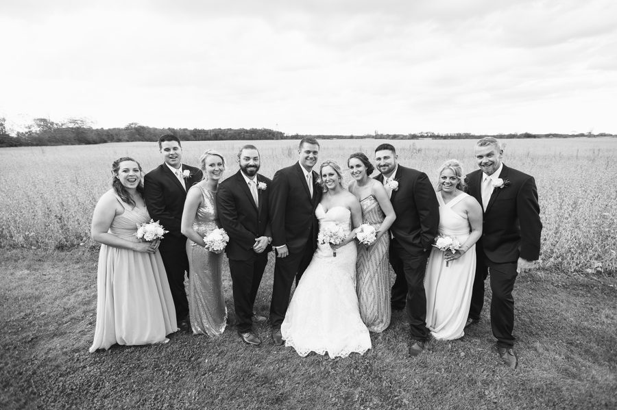 black and white photo of wedding party near field