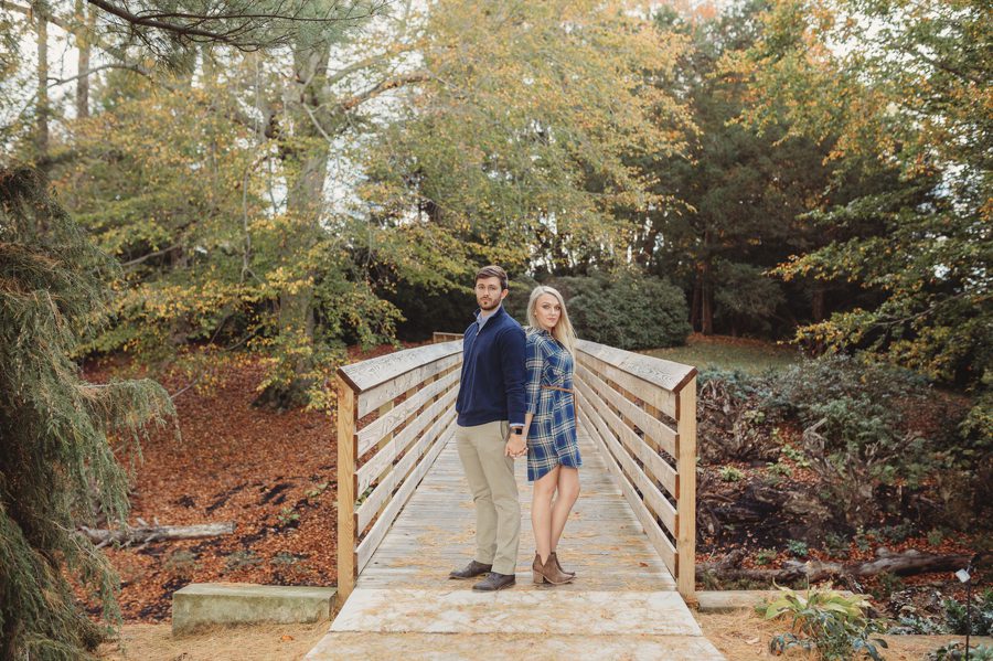 engaged couple on bridge at Dawes Arboretum