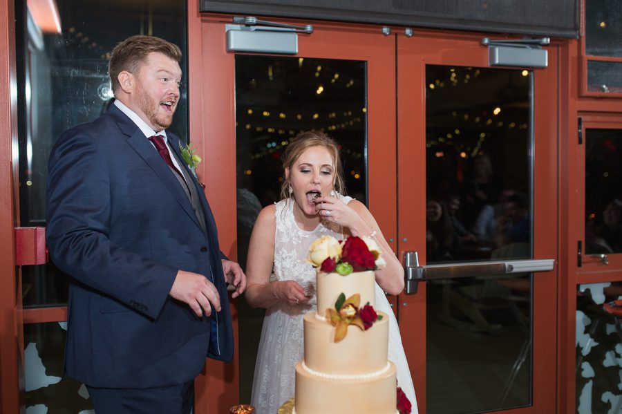 bride feeding herself wedding cake