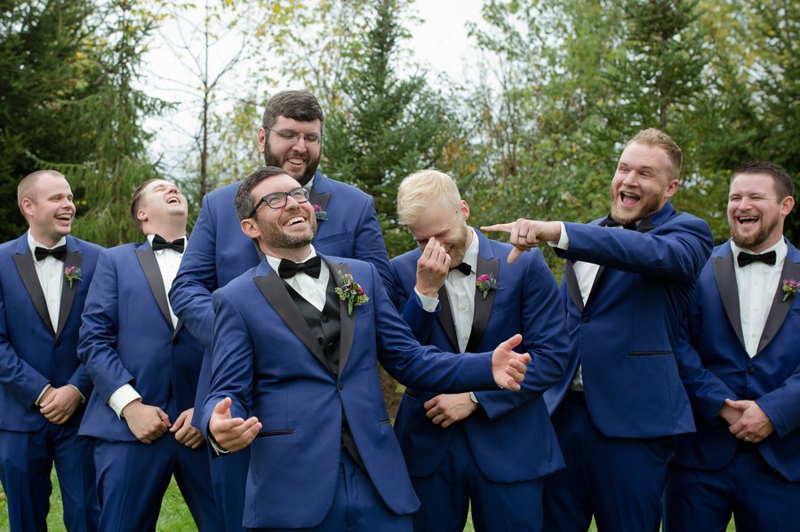 groomsmen making fun of groom