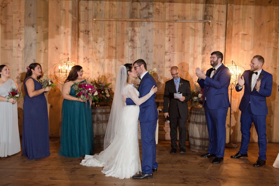 bride and groom share first kiss as husband and wife