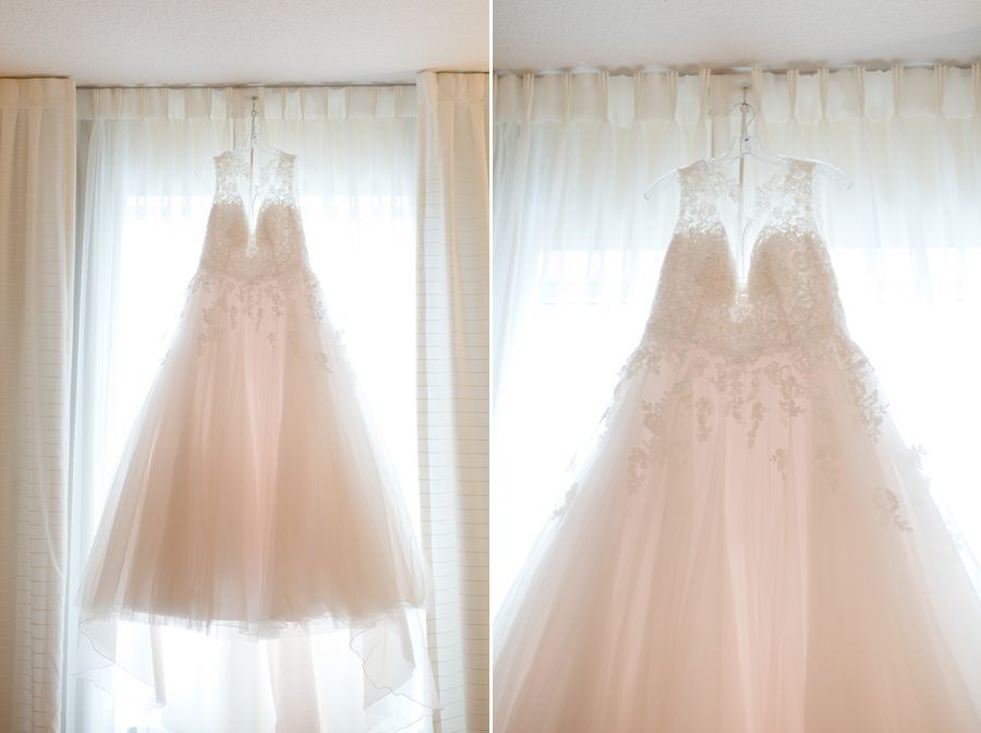 wedding dress hanging in window at la scala wedding