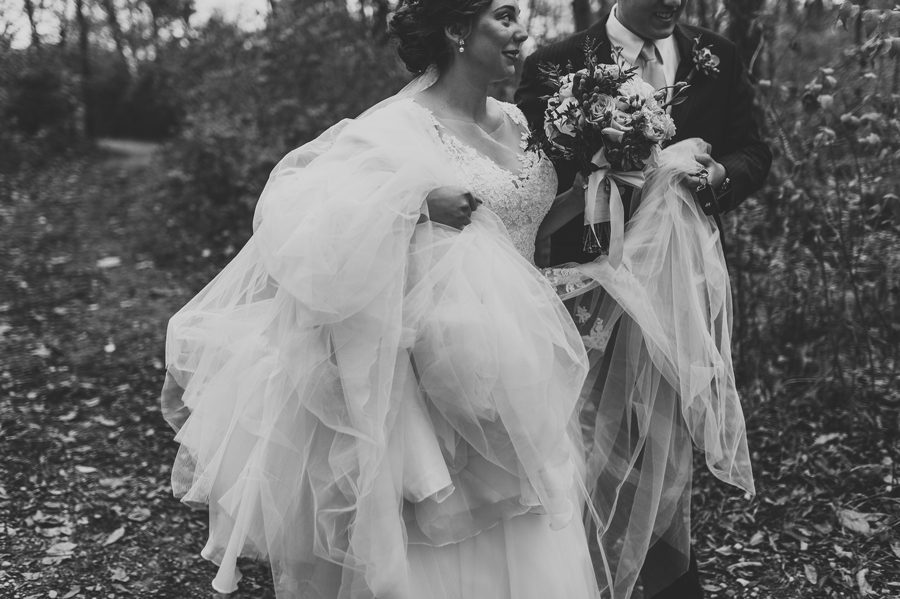 black and white photo of married couple walking at la scala wedding