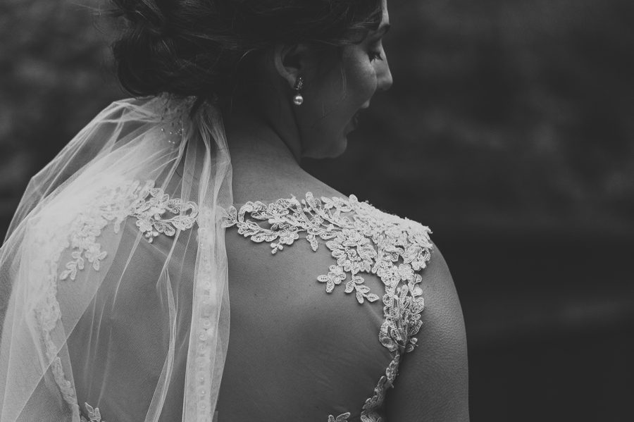 close up black and white photo od wedding dress detail