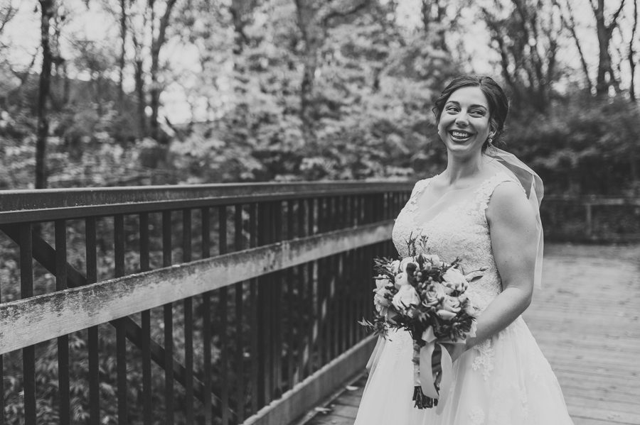 black and white photo of bride looking off and smiling