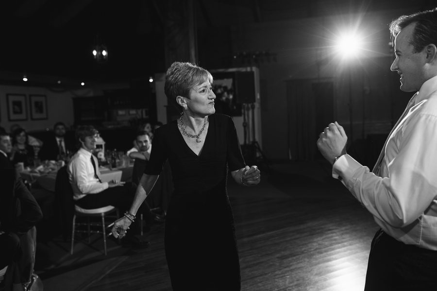 black and white photo of mother son dance