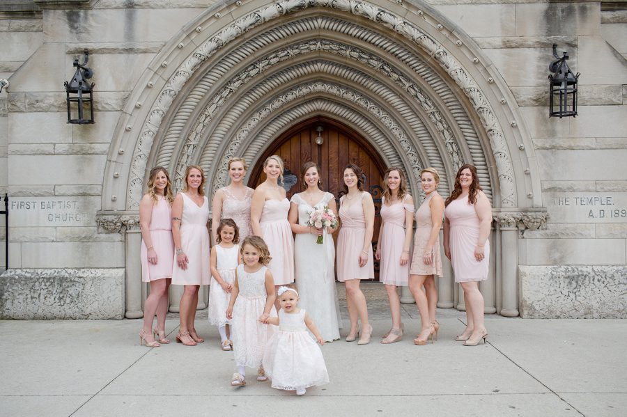 bride and bridesmaids in front of the bluestone columbus