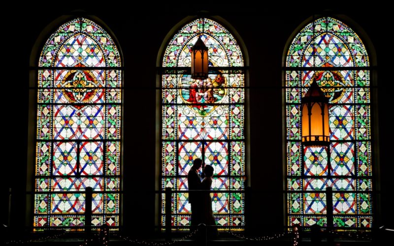 silhouette photo of bride and groom at the bluestone