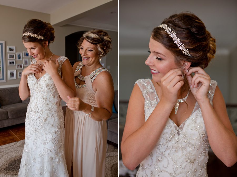 bride putting on wedding jewelry