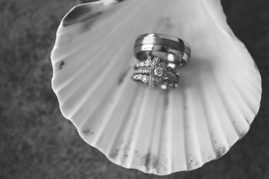 black and white photo of wedding rings at ocean isle beach wedding