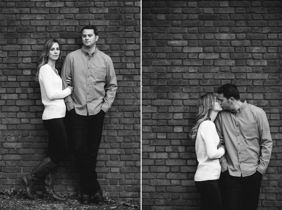 engaged couple leaning on brick wall at Ohio University engagement