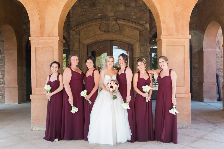 bride with bridemaids in burgundy dresses at the corazon