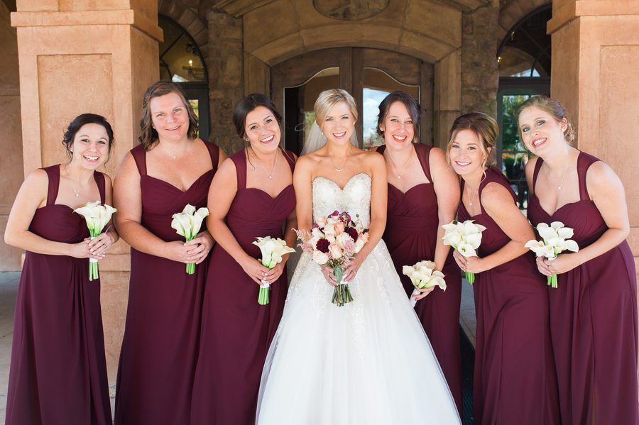closes up photo of bride with wedding party