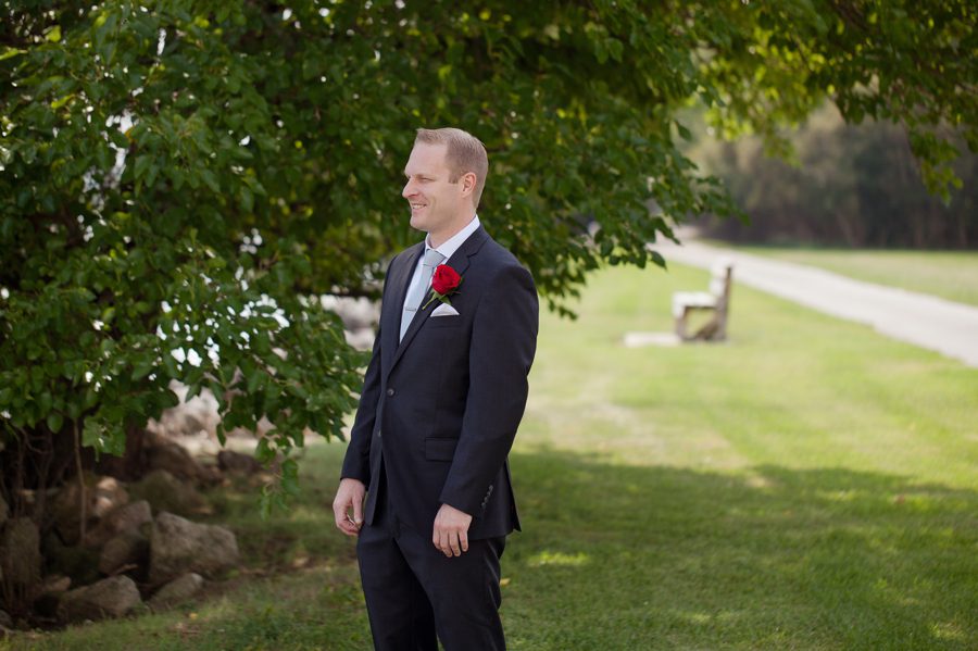 groom waiting on bride for first look