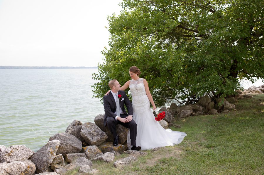 bride and groom along waterfront at Grand Lake Galleria