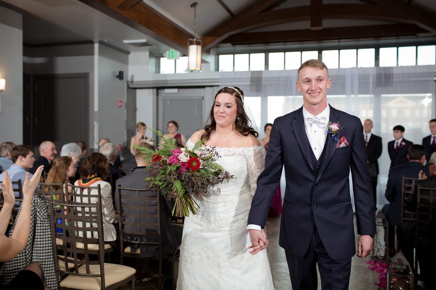 bride and groom during recessional