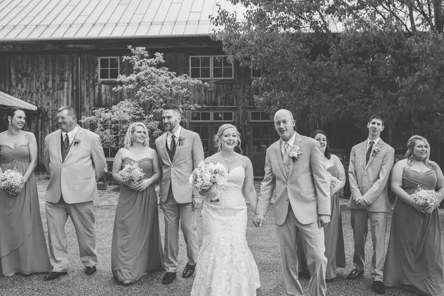 black and white photo of wedding party walking