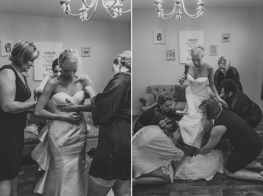 bride getting into wedding dress