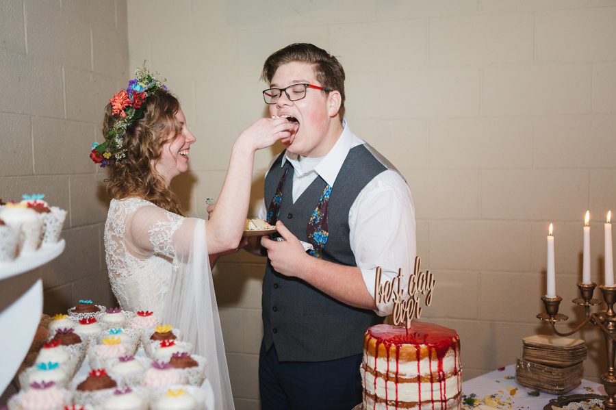 bride feeding groom wedding cake at newark ohio elopement