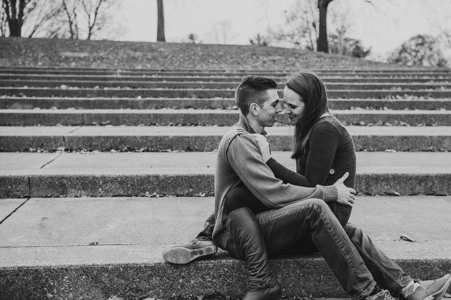 black and white photo of couple sitting on steps