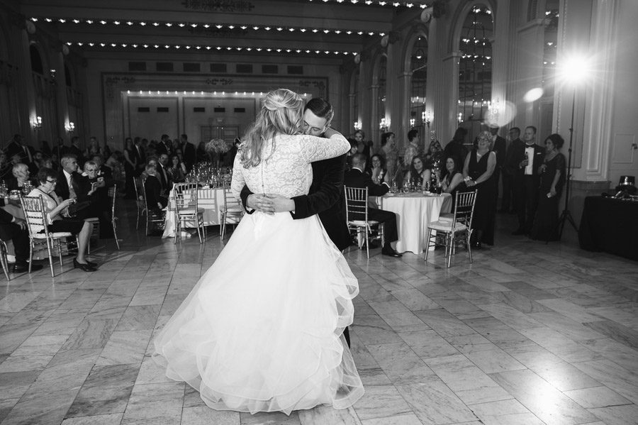 groom hugging bride during first dance
