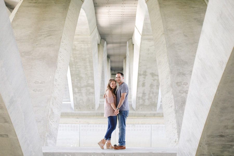 engaged couple under scioto mile bridge columbus ohio
