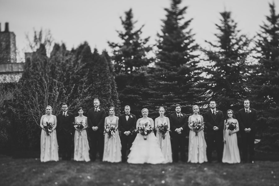 black and white serious photo of wedding party