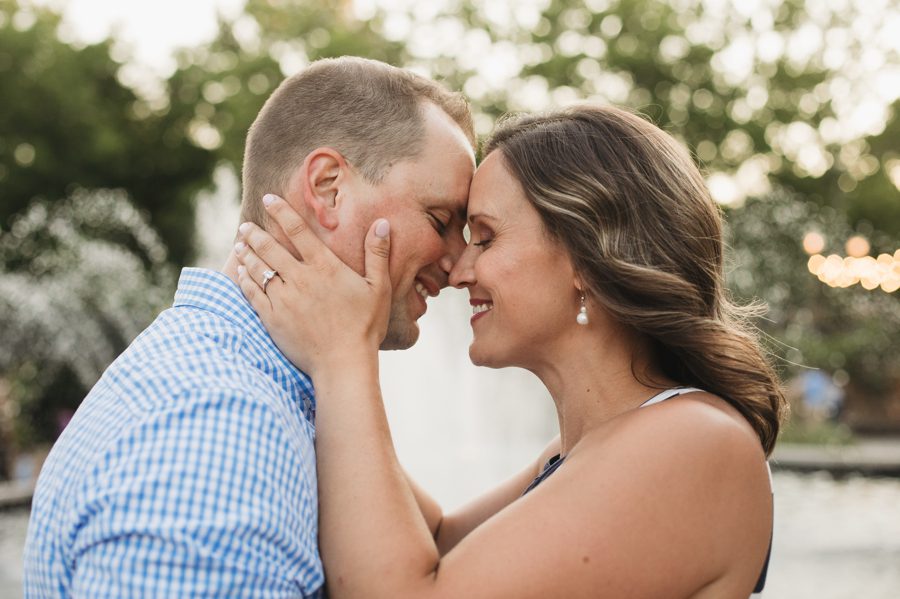 bride holding grooms face at creekside gahanna engagement