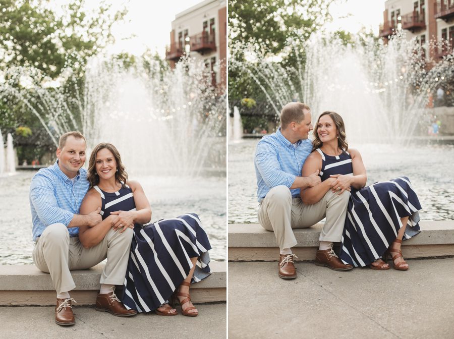 creekside gahanna engagement of couple sitting in front of water fountain